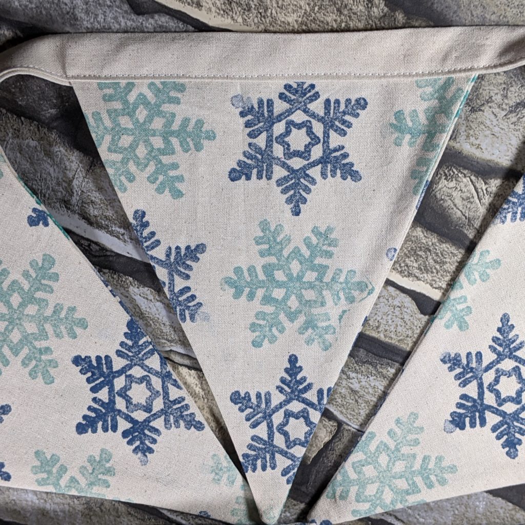 Snowflake bunting in midnight blue and aquamarine