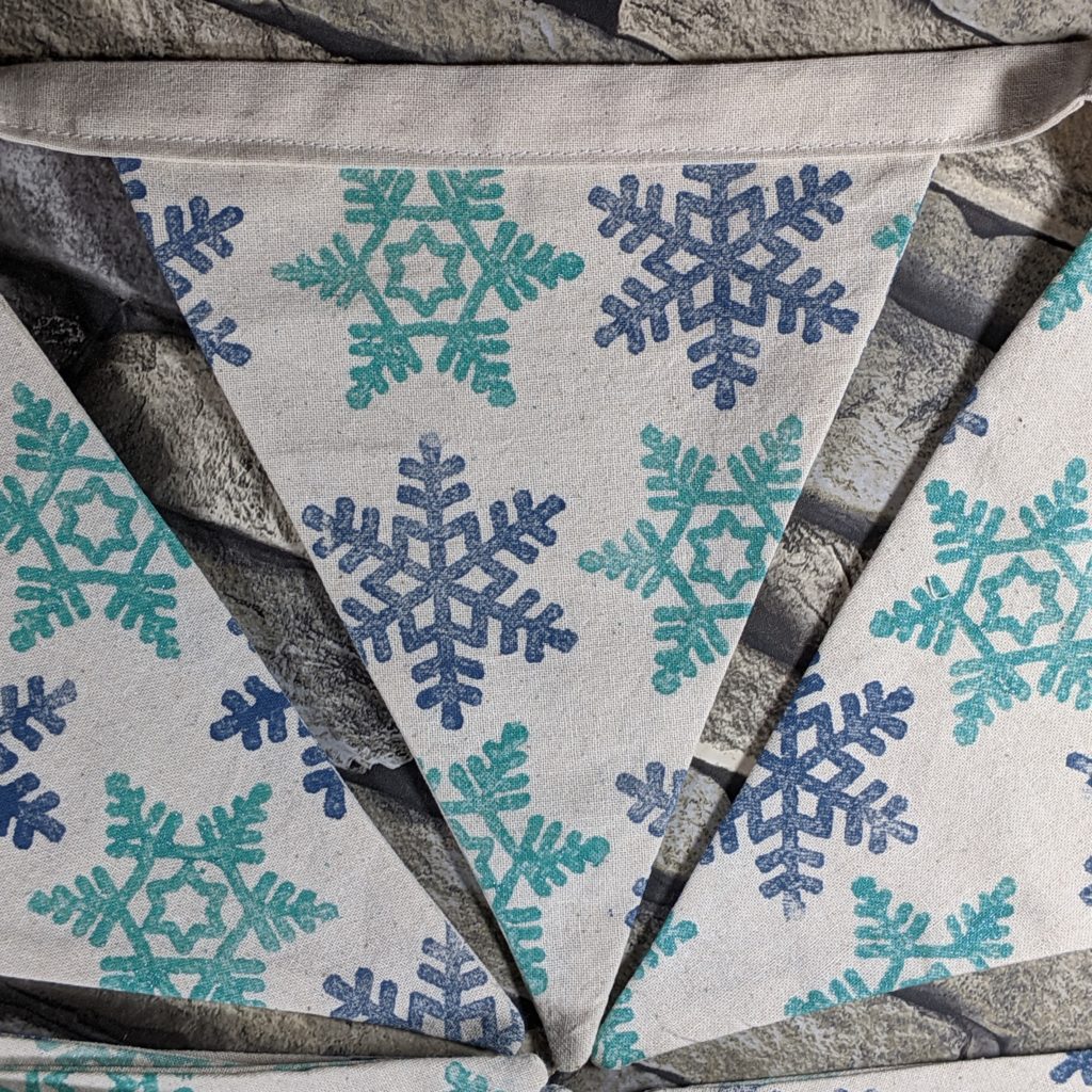 Snowflake bunting in midnight blue and teal